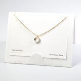 101599, 14K GOLD DIPPED, DAINTY CUTOUT ROUND CUBIC ZIRCONIA CHARM NECKLACE
