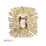 112662, LARGE EMERALD CUT CRYSTAL TEXTURED SUNBURST BROOCH PIN