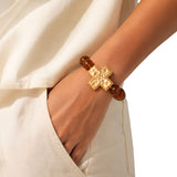 113339, HAMMERED CROSS AND MARBLED BEAD STRETCH BRACELET