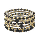 SB1185BLK 2 · Cross Accent Multi Layered Beaded Stretch Bracelet – Gold/Black
