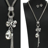 97893SILVER/CLEAR. FLOWER & HEART CHARM RHINESTONE LONG PENDANT NECKLACE