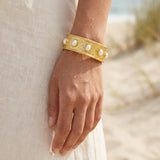 113498, WATER RESISTANT 24K GOLD TONE HALF OVAL PEARL STRETCH BRACELET