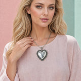 Model wearing Western Stamped Frame Puffed Heart Papercl